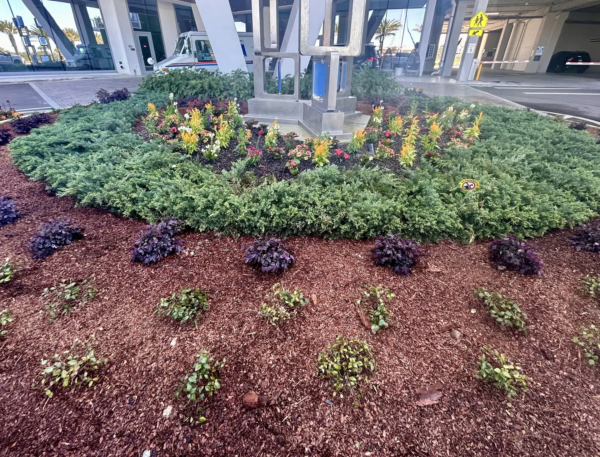 Seasonal planting in a circular bed at a Tampa commercial property