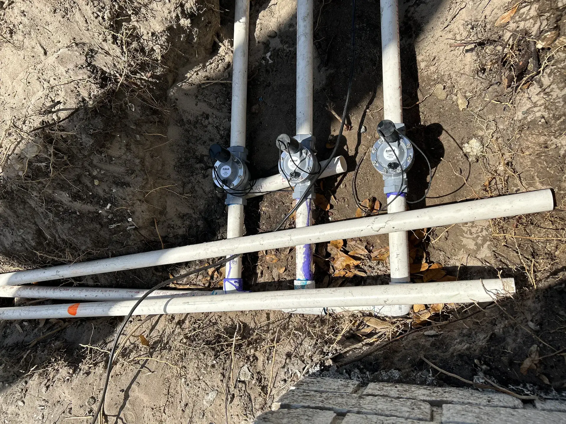 Irrigation valves and pipe installed in a trench in Tampa