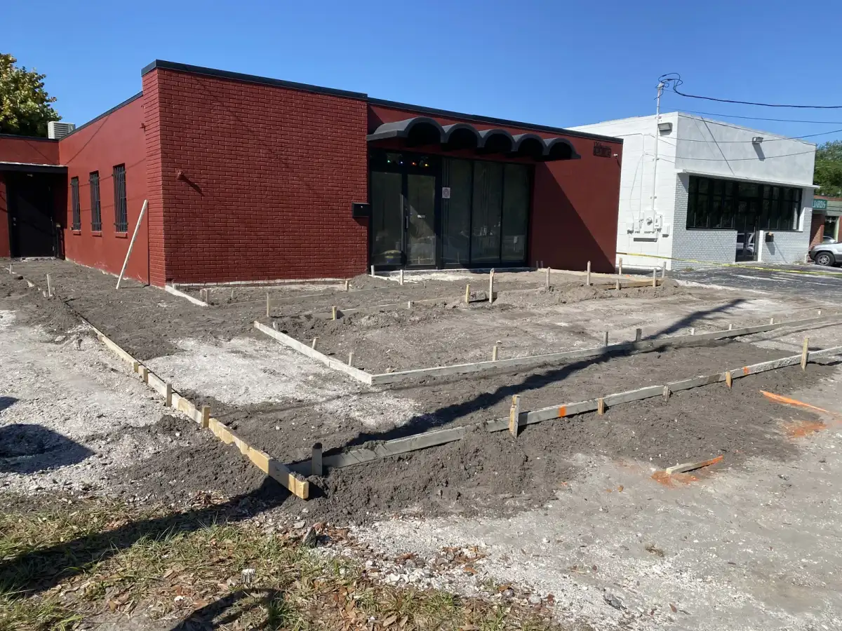 Sidewalk at a Tampa commercial property during base work and after repair